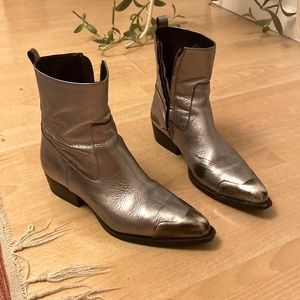 Metallic western bootie with steel cap toe.